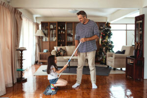 Father and daughter cleaning